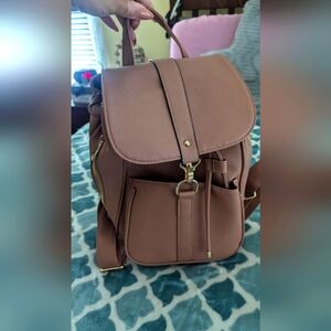 Cute pink backpack used once. Great condition. No tears, rips or stains